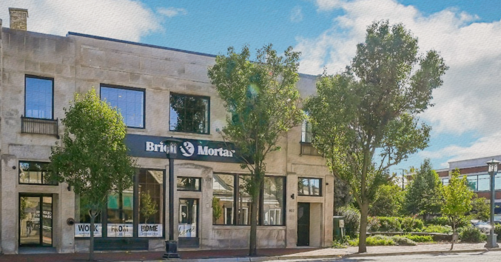 Brick and Mortar location photographed from the outside on a sunny day in the suburbs