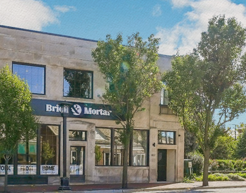 Brick and Mortar location photographed from the outside on a sunny day in the suburbs