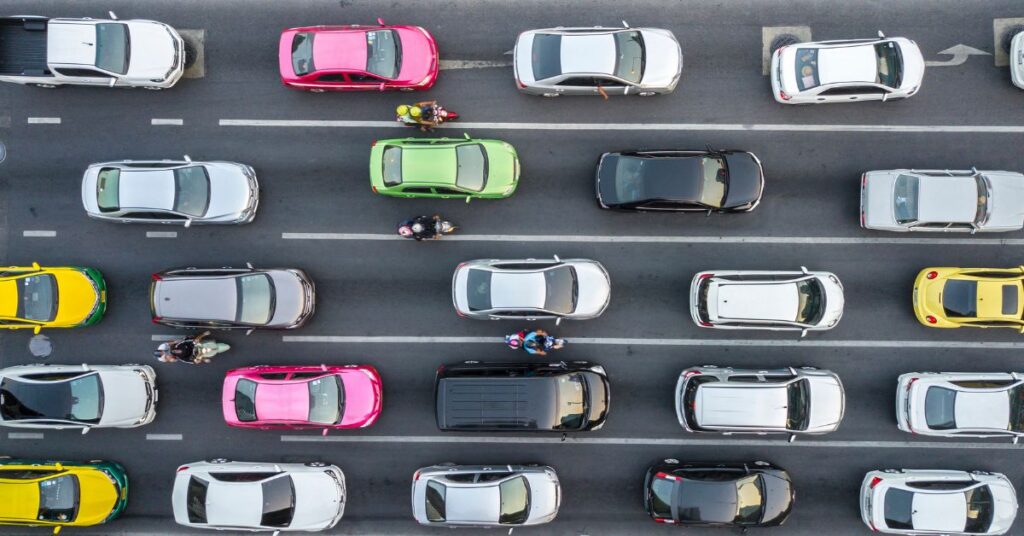 bird eye view of very busy 5 lane high way with cars
