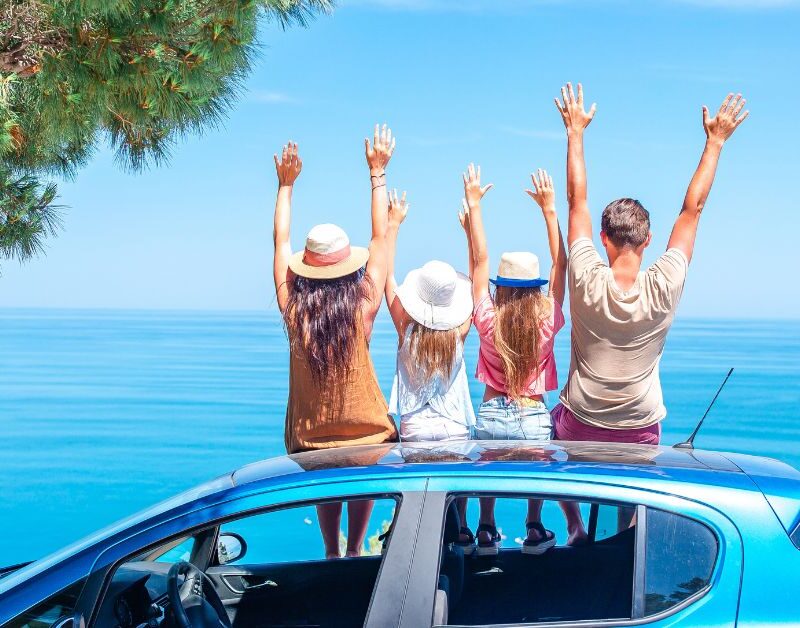 family saying good bye to their beach vacation and getting. ready to get back to work after vacation