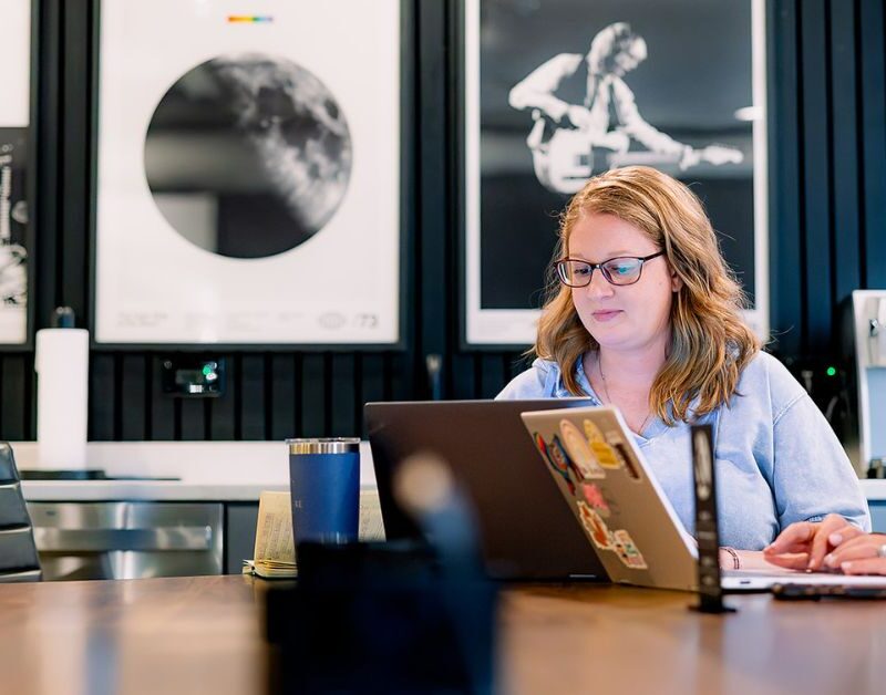 two brick and mortar members taking control of their workday and meeting in our collab room