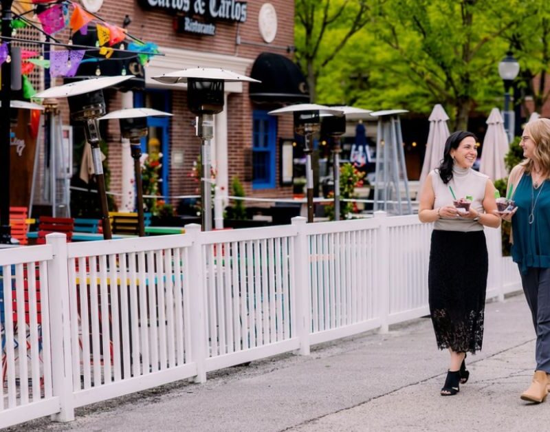two brick & mortar members walking in arlington heights downtown enjoying the neighborhood after a fun day of coworking in Brick and Mortar in downtown Arlington Heights