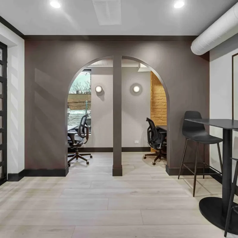 Flexible coworking workstations and shared seating area at Brick & Mortar.