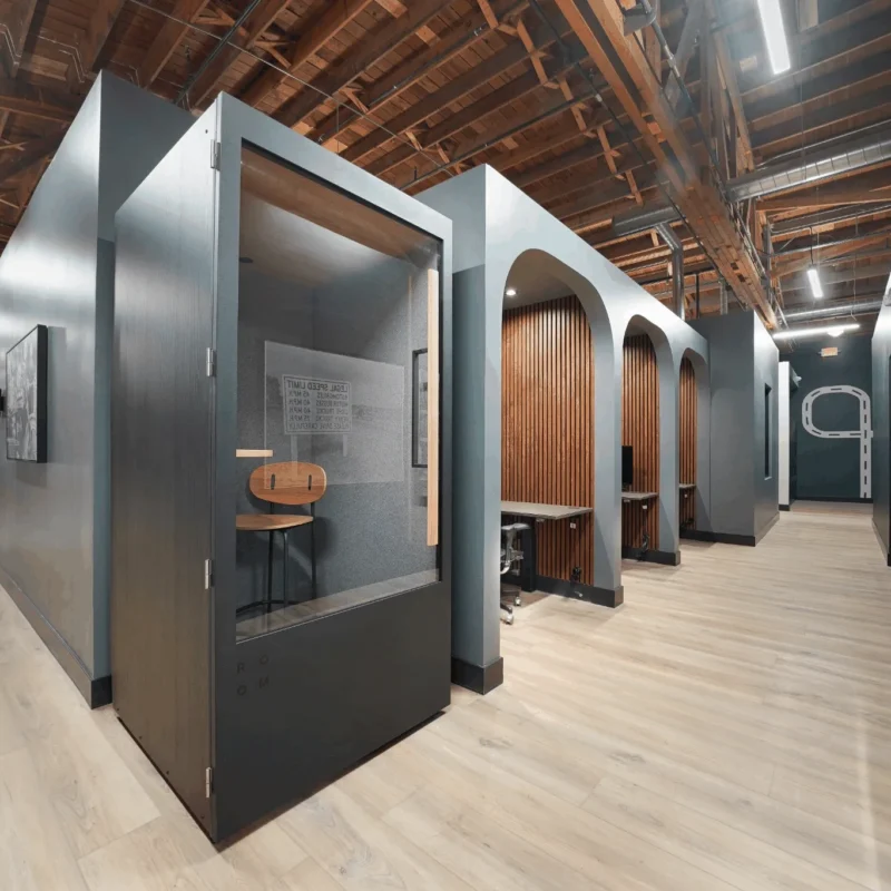 Private phone booth and dedicated workspaces at Brick & Mortar coworking space