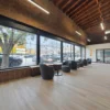 Comfortable coworking lounge with natural light and seating at Brick & Mortar