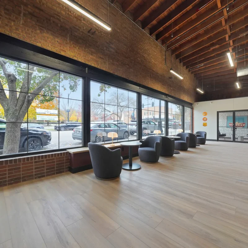 Comfortable coworking lounge with natural light and seating at Brick & Mortar